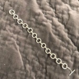 Pave rhinestone circle link silver tone bracelet